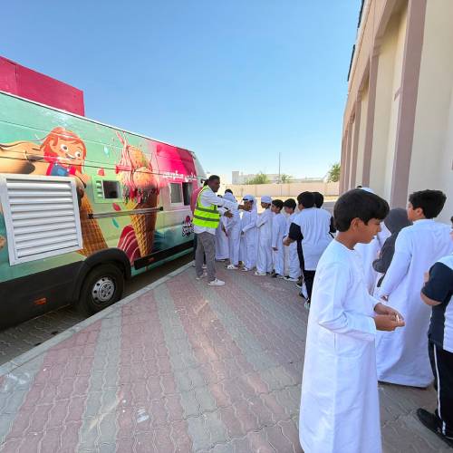 Kids queuing up at Happy Scoops Ice Cream truck